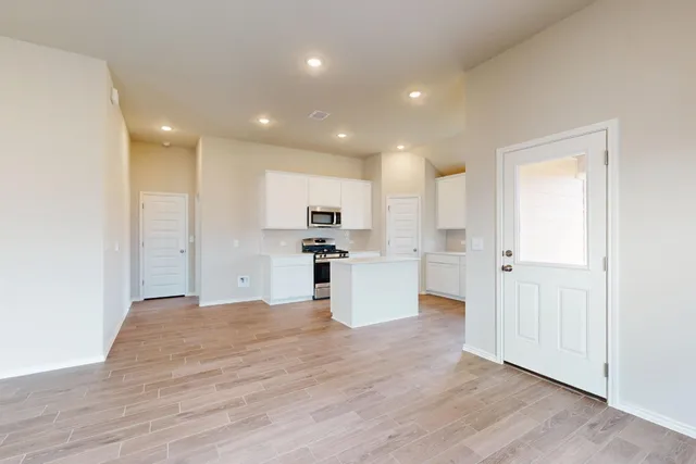 a view of kitchen with wooden floor