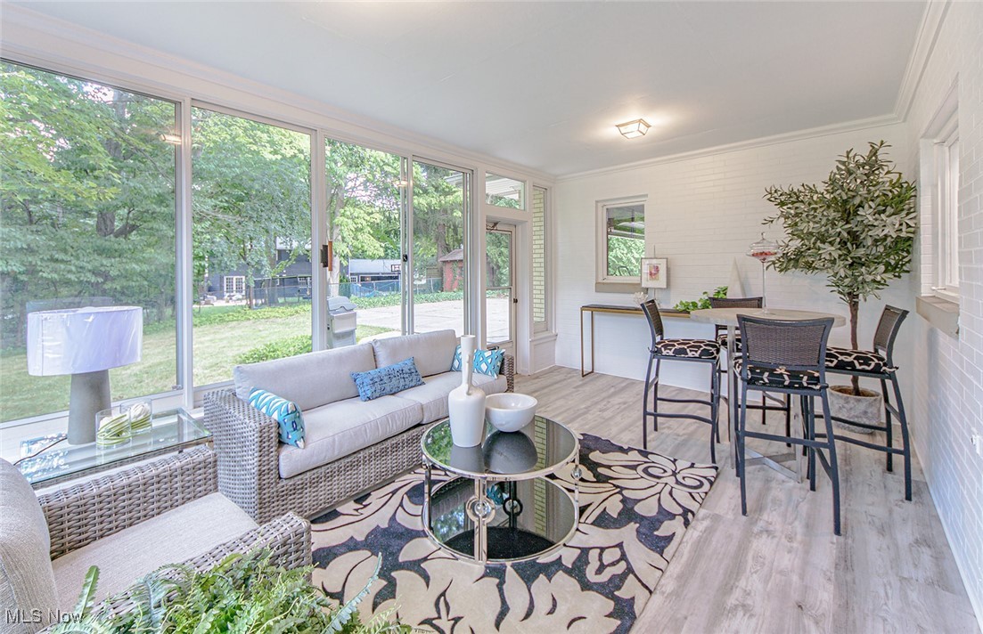 2445 Chatham Road Akron, OH 44313 - Photo 12 of 32 Relax and enjoy the enclosed three seasons sunroom.