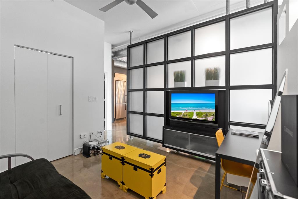 313 Northeast 2nd Street, Unit 405 Fort Lauderdale, FL 33301 - Photo 16 of 49 a living room with a flat screen tv and a window