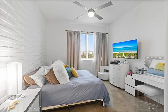 a bedroom with a bed and a lamp