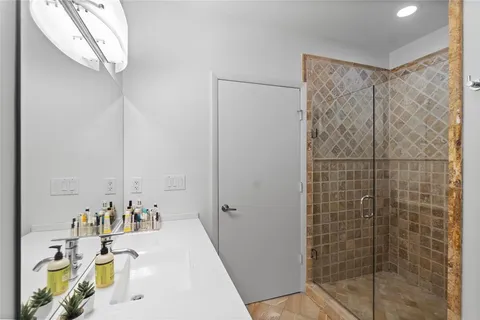 a kitchen with stainless steel appliances kitchen island granite countertop a refrigerator and a stove