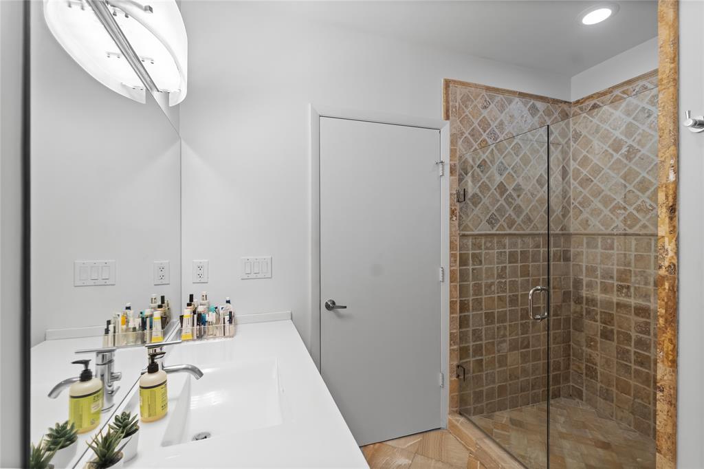 313 Northeast 2nd Street, Unit 405 Fort Lauderdale, FL 33301 - Photo 24 of 49 a bathroom with a shower and a sink