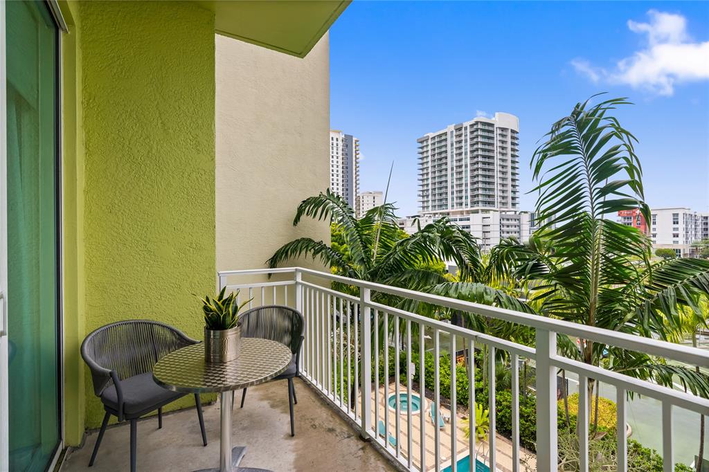 313 Northeast 2nd Street, Unit 405 Fort Lauderdale, FL 33301 - Photo 28 of 49 a view of balcony with two chairs and a potted plant