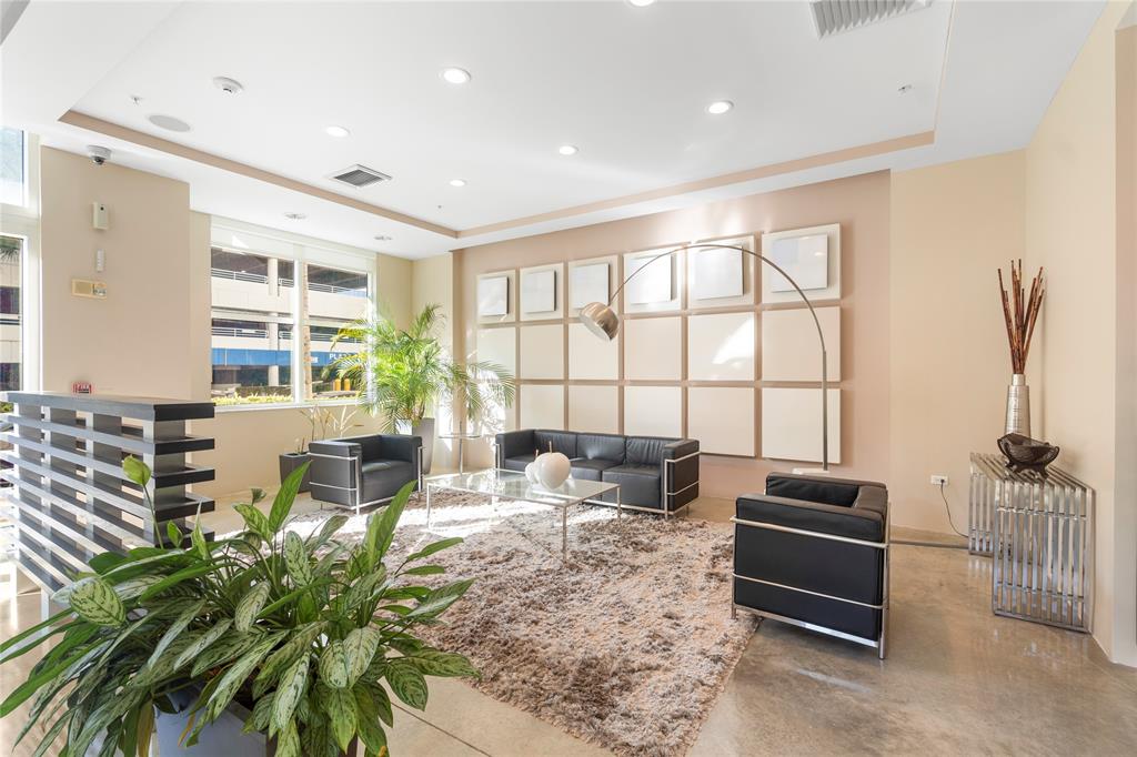 313 Northeast 2nd Street, Unit 405 Fort Lauderdale, FL 33301 - Photo 38 of 49 a living room with furniture and a floor to ceiling window