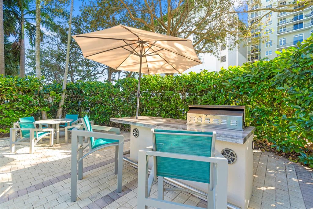 313 Northeast 2nd Street, Unit 405 Fort Lauderdale, FL 33301 - Photo 43 of 49 a view of a chairs and table in the patio