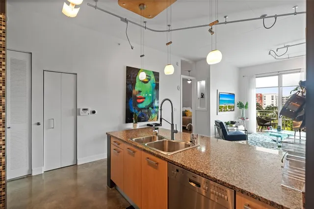 a kitchen with counter top space and stainless steel appliances