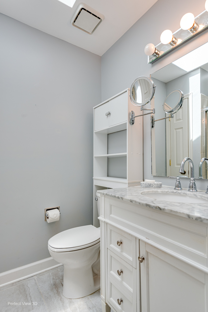 -n120 Windermere Road, Unit 2008 Winfield, IL 60190 - Photo 15 of 23 a bathroom with a granite countertop toilet sink and mirror