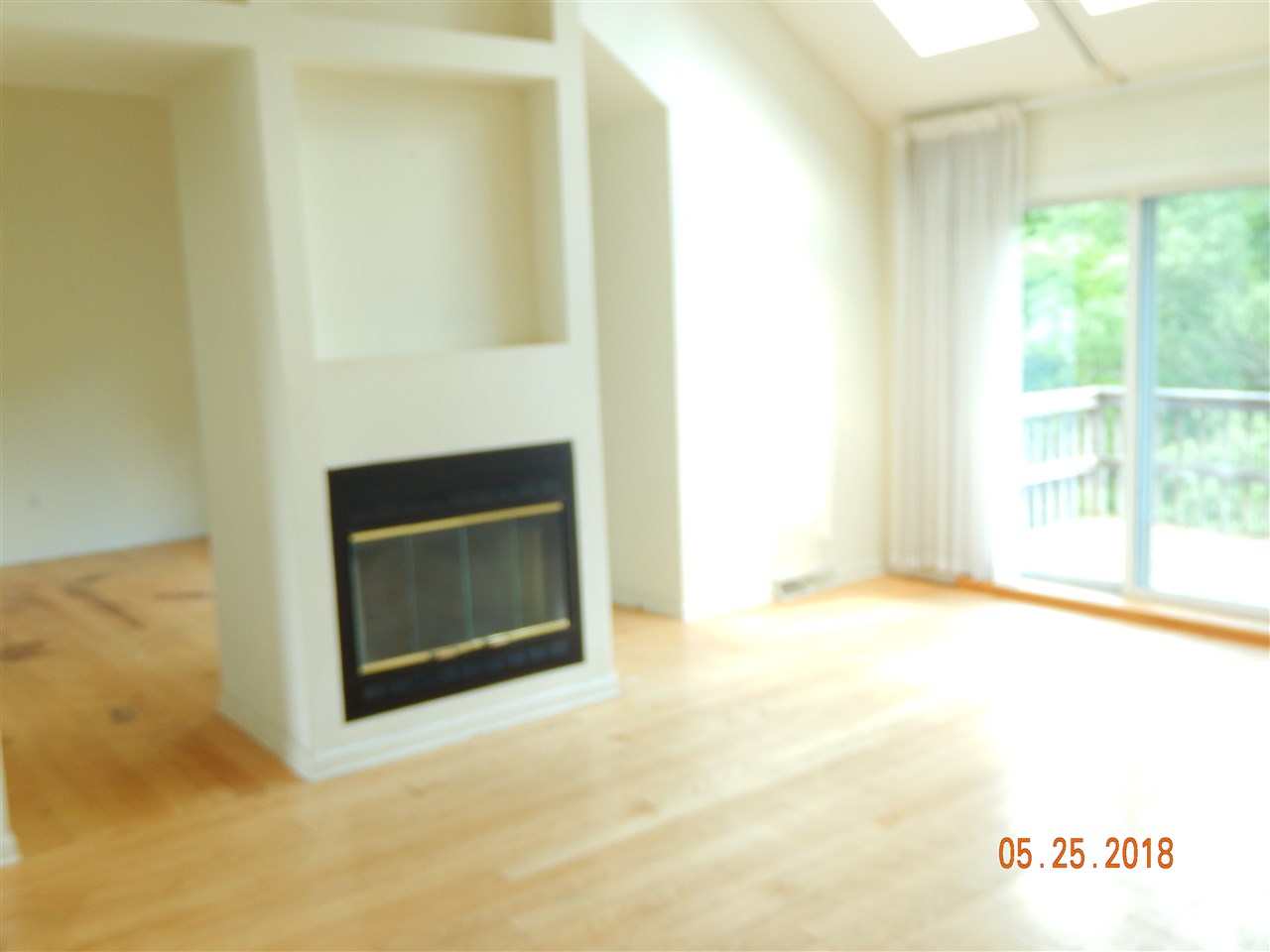 1338 Amicus Road Stanardsville, VA 22973 - Photo 13 of 33 a view of an empty room with a fireplace and a window