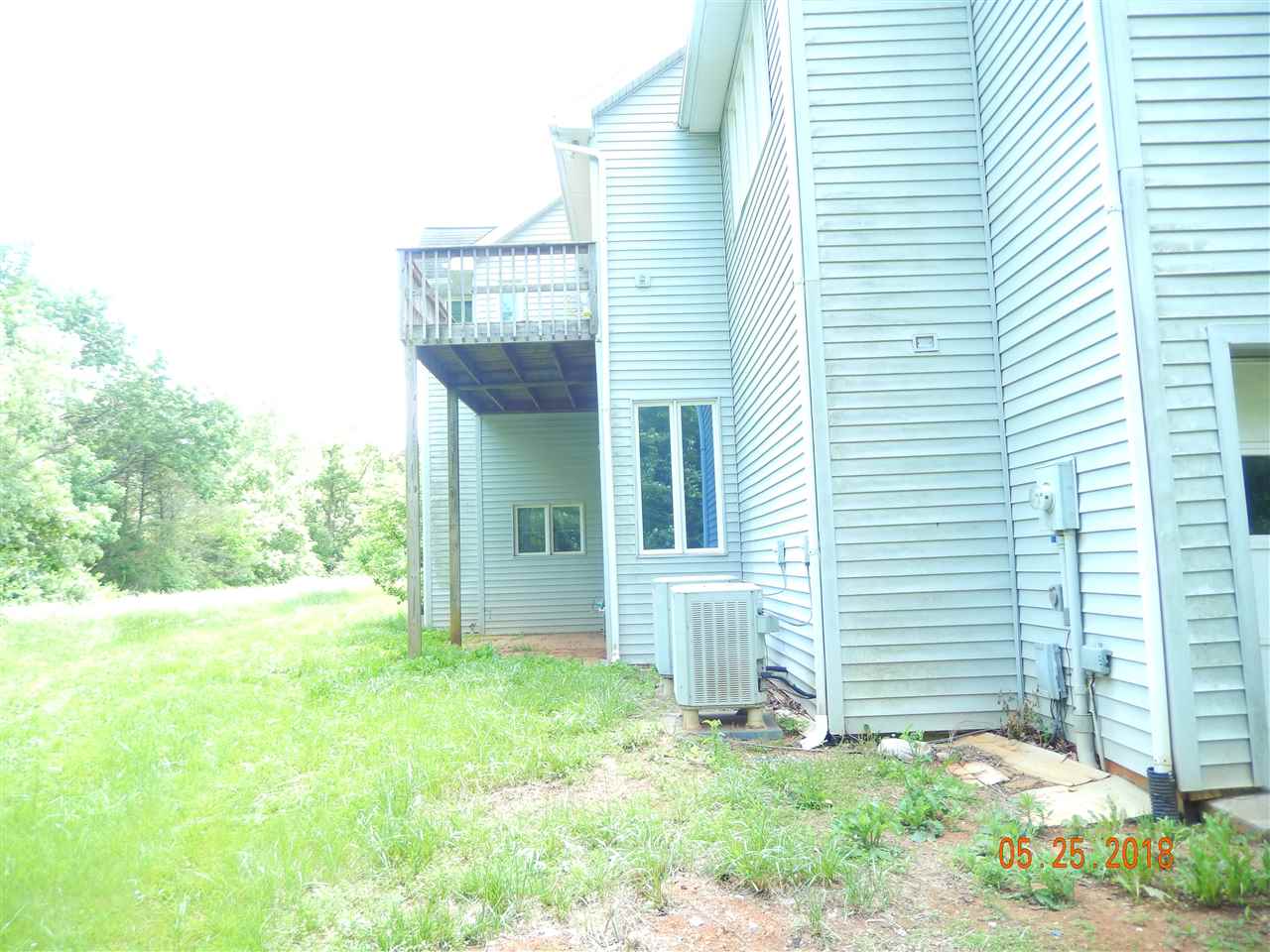 1338 Amicus Road Stanardsville, VA 22973 - Photo 2 of 33 a front view of a house with garden