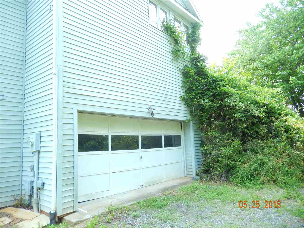 1338 Amicus Road Stanardsville, VA 22973 - Photo 5 of 33 a front view of a house with a yard