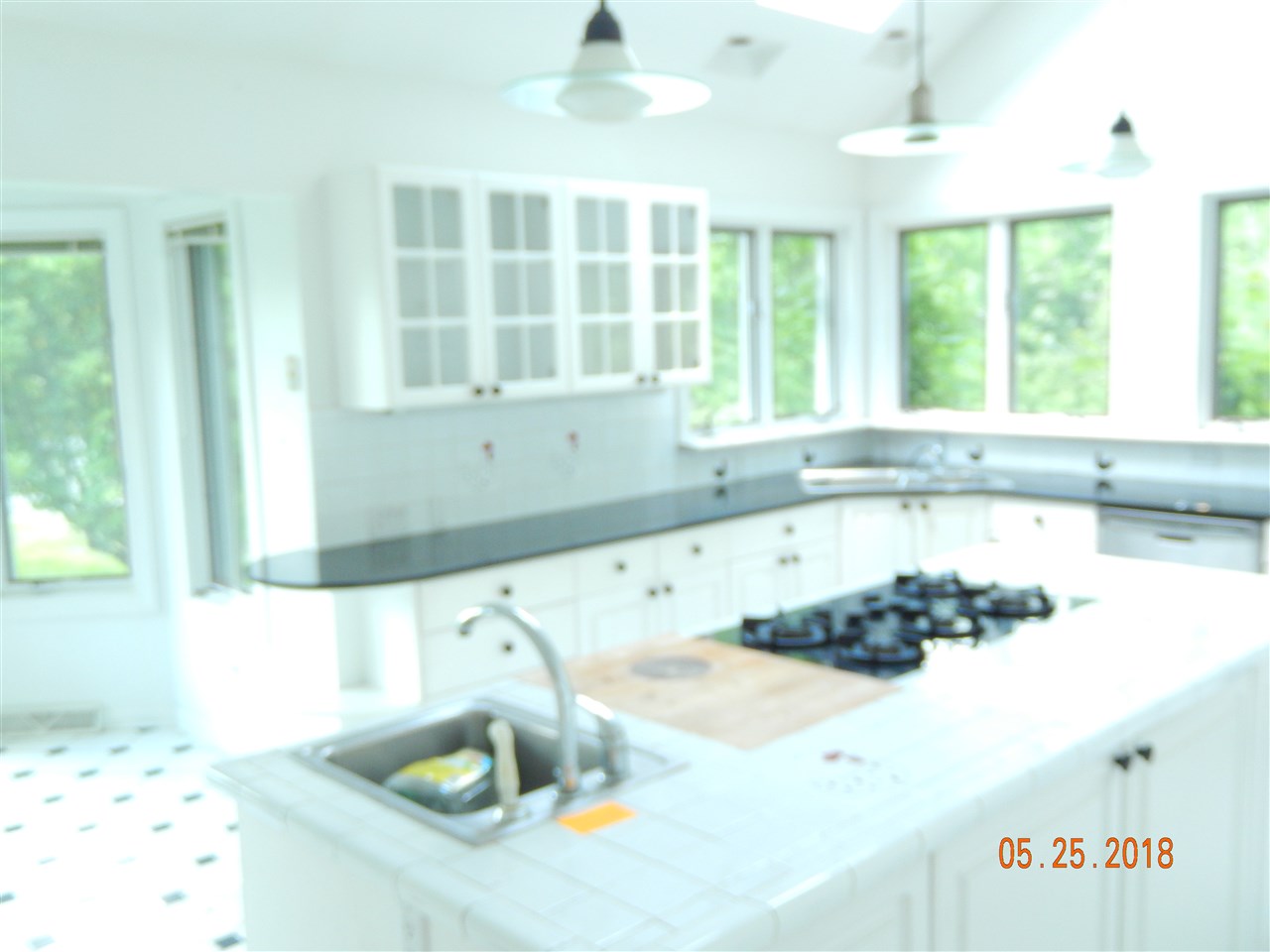 1338 Amicus Road Stanardsville, VA 22973 - Photo 10 of 33 a kitchen with a stove a sink and a window