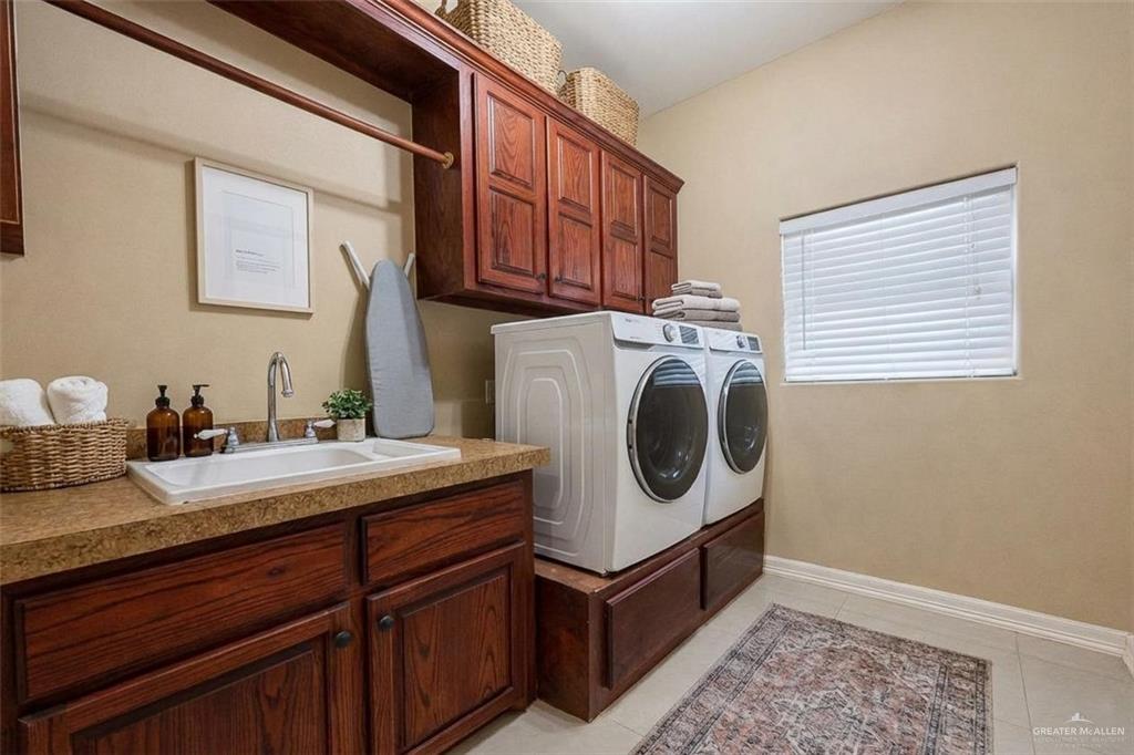 1339N North FM 649 Rio Grande City, TX 78582 - Photo 16 of 37 a utility room with sink dryer and washer