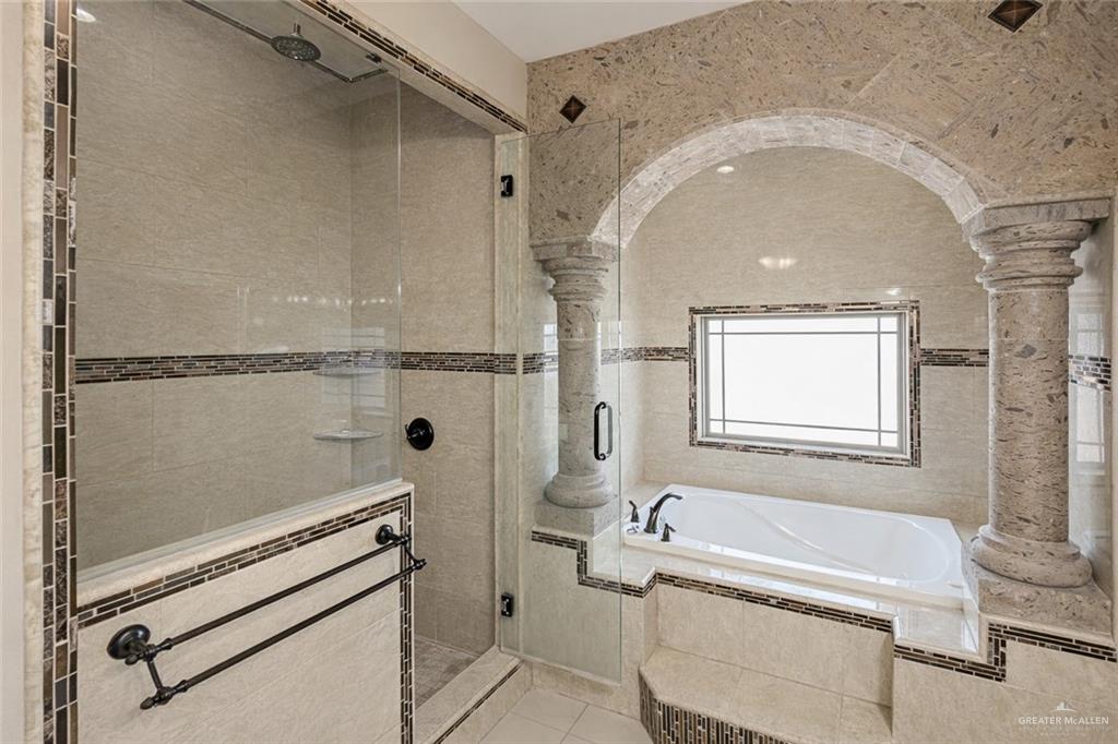 1339N North FM 649 Rio Grande City, TX 78582 - Photo 25 of 37 a bathroom with a tub a toilet and a shower