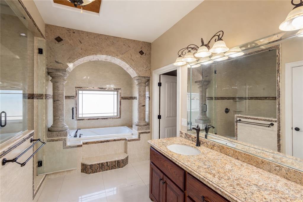 1339N North FM 649 Rio Grande City, TX 78582 - Photo 28 of 37 a spacious bathroom with a granite countertop sink mirror and vanity