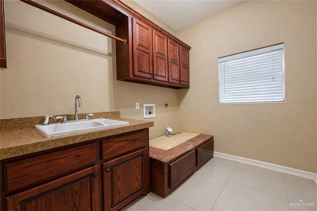 1339N North FM 649 Rio Grande City, TX 78582 - Photo 31 of 37 a bathroom with a double vanity sink and a mirror