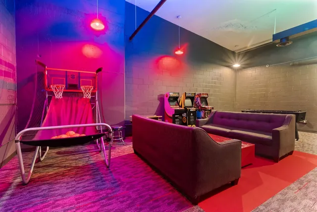 a room with pool table and furniture