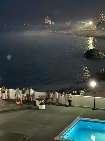 a view of swimming pool with outdoor seating