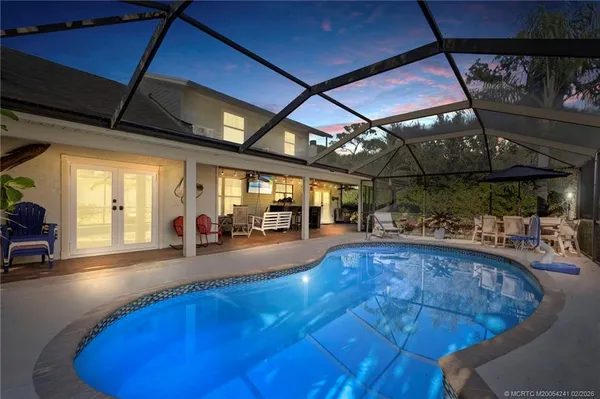 a view of a swimming pool with a patio