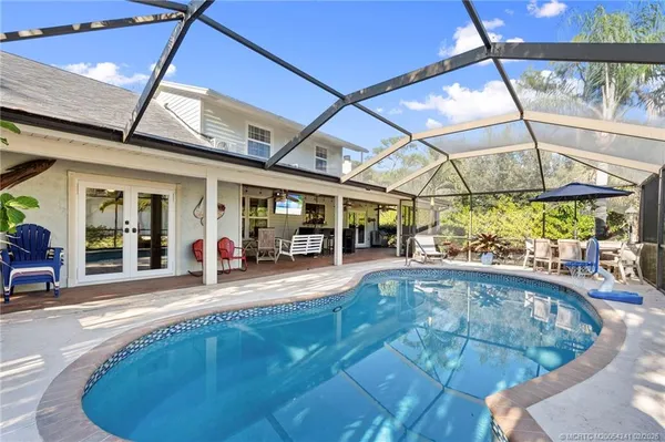 a view of a swimming pool with a patio