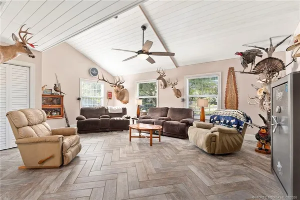 a living room with furniture a couch and a window