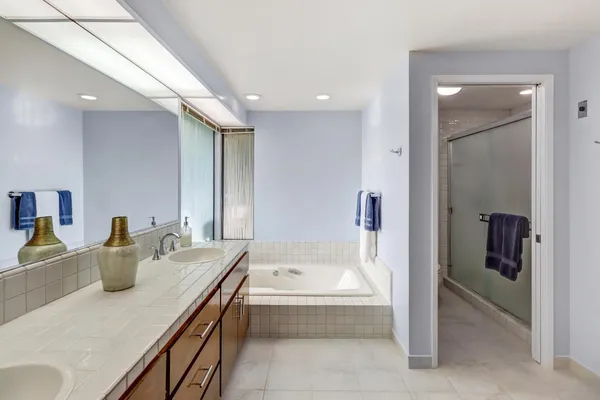 a bathroom with a tub and a sink