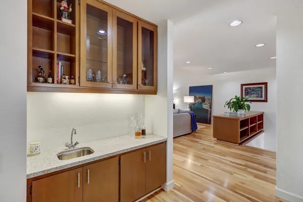 a spacious bathroom with a sink and a mirror