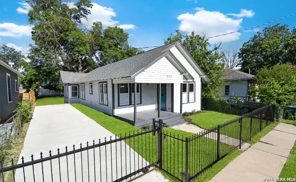 a view of a house with backyard and porch