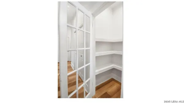 a view of a hallway with white walls