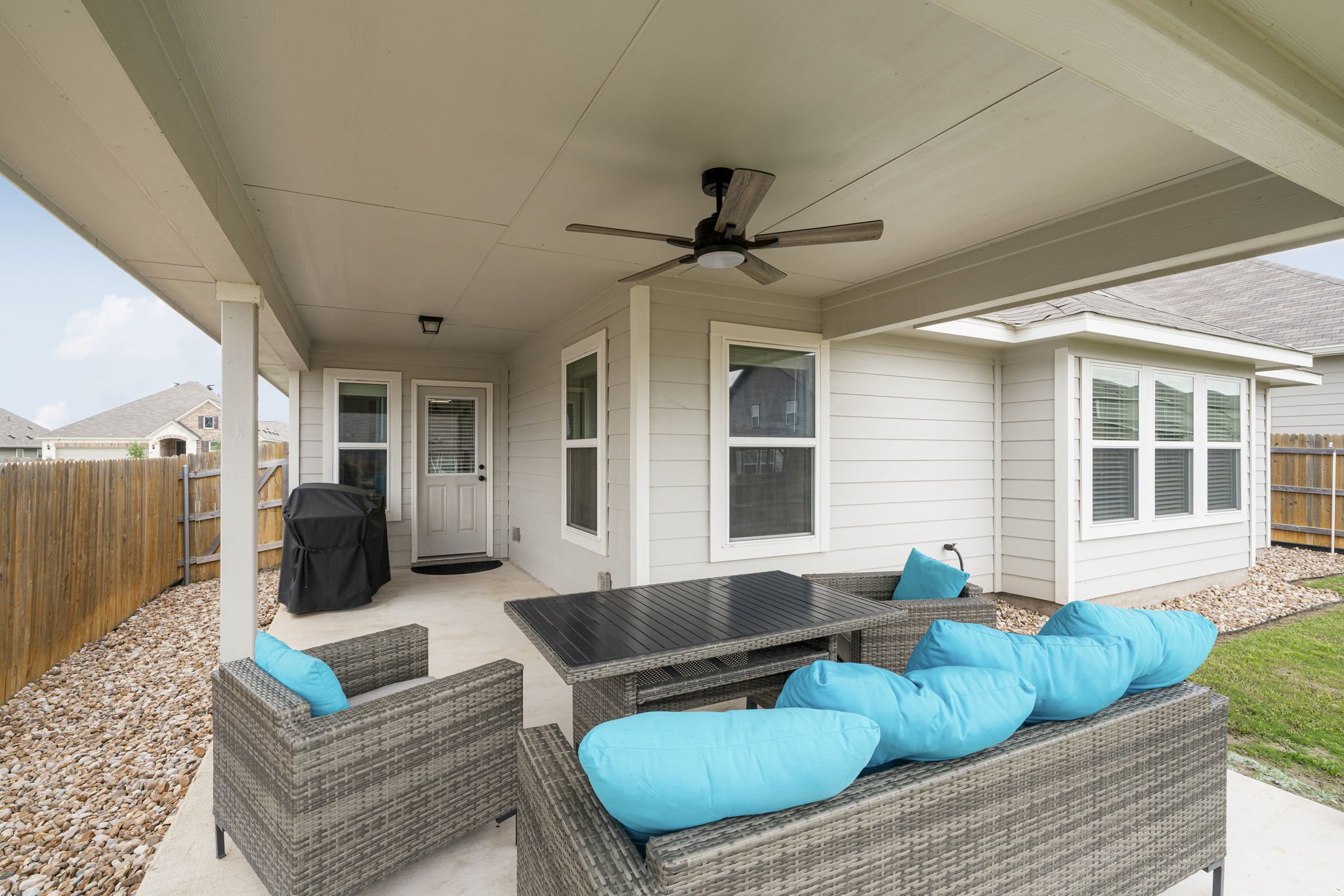19412 Forman Drive Pflugerville, TX 78660 - Photo 28 of 34 A ceiling fan helps keep the patio cool and comfortable during warm Texas evenings.
