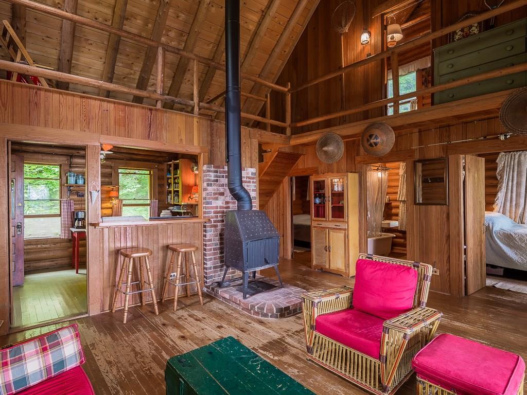 106 Herring Road Rangeley, ME 04970 - Photo 12 of 25 Kitchen is to the left with an open...