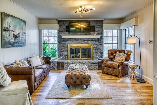 a large kitchen with cabinets table and chairs