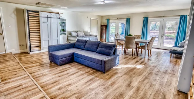 a dining room with furniture and window
