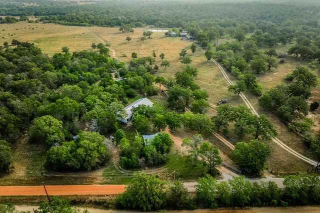a view of a house with large tree