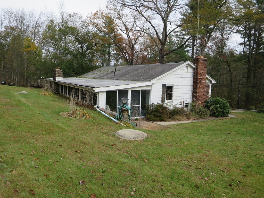 680 Brimfield Road Warren, MA 01083 - Photo 24 of 26 a view of a house with a yard table and chairs
