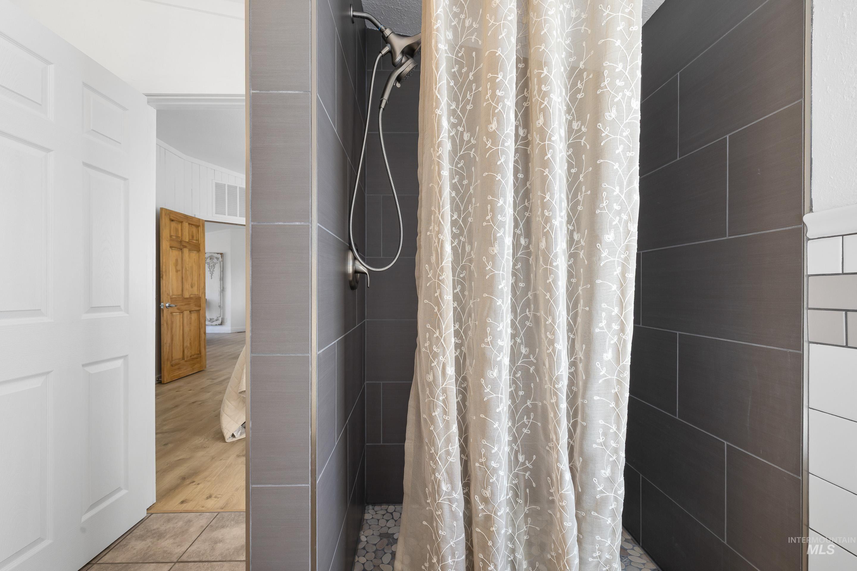 2427 Northside Road Homedale, ID 83628 - Photo 20 of 49 Full bathroom featuring a stall shower and light tile patterned flooring