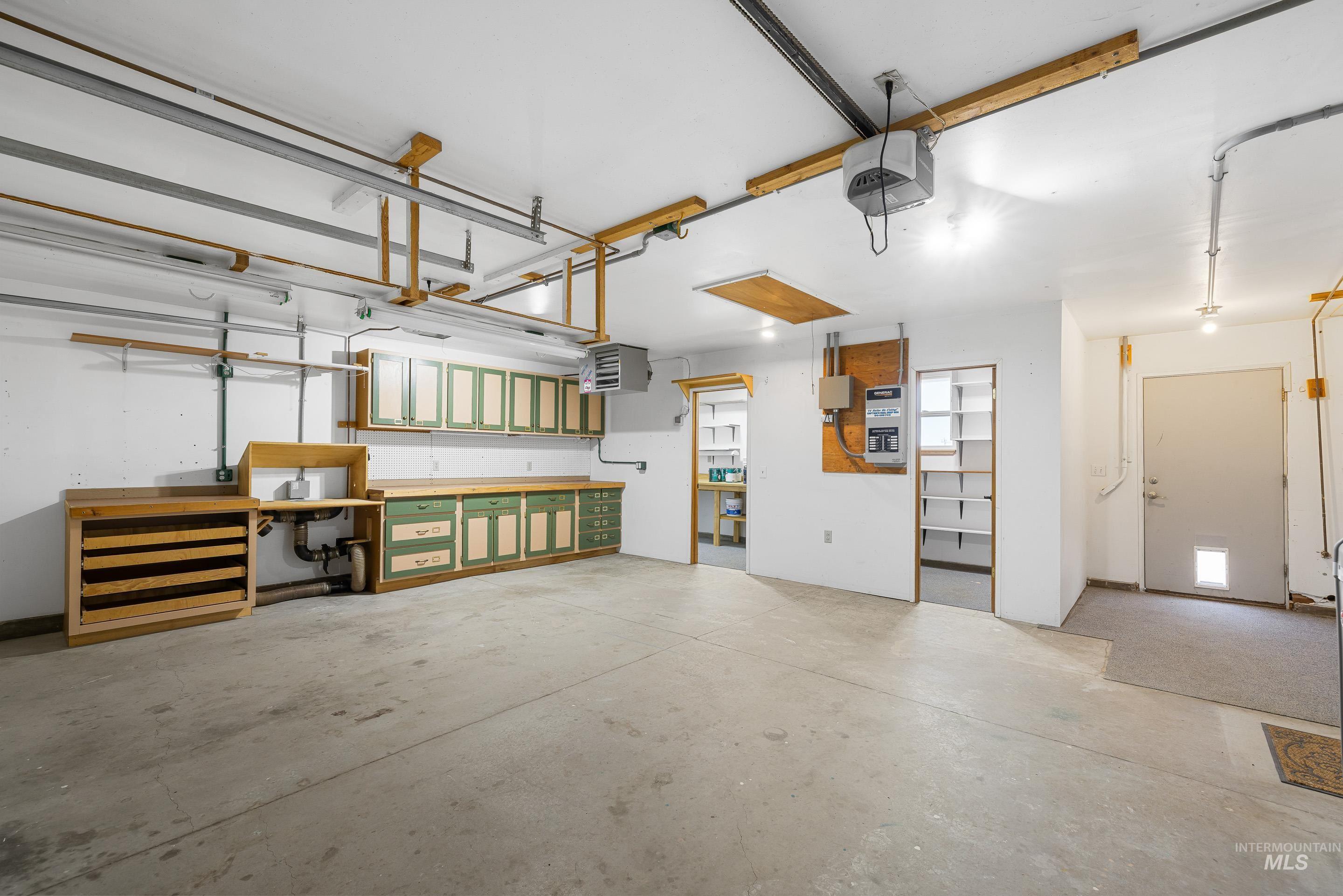 2427 Northside Road Homedale, ID 83628 - Photo 24 of 49 Garage with a heating unit and a garage door opener