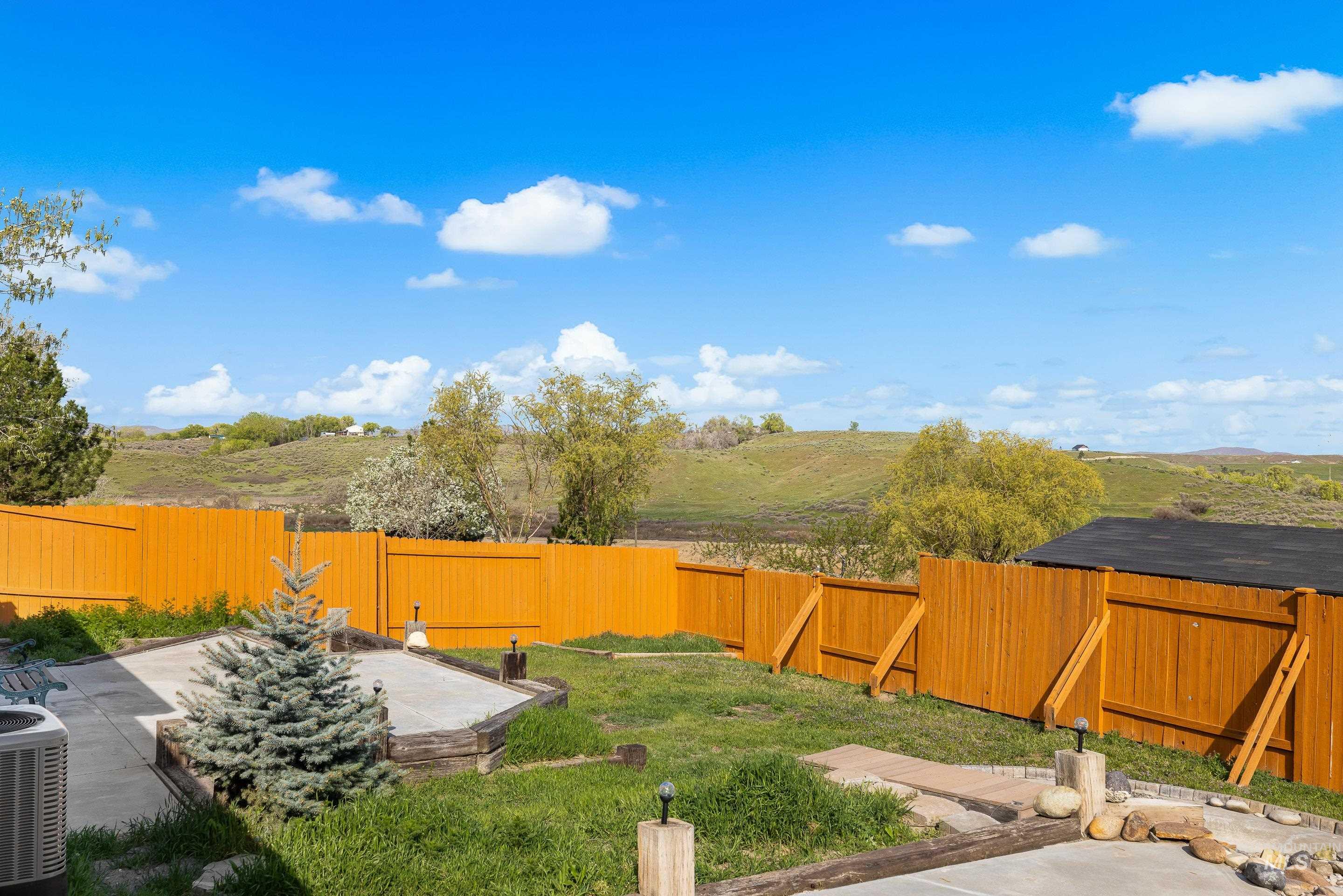 2427 Northside Road Homedale, ID 83628 - Photo 37 of 49 Fenced backyard with a patio
