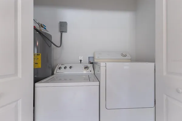 a utility room with dryer and washer