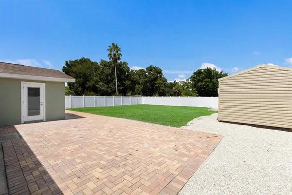 a view of a backyard of the house