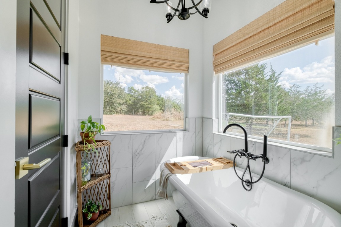1901 Highway 21, Unit B Paige, TX 78659 - Photo 11 of 40 a bedroom with a bed and a large window with the outer view