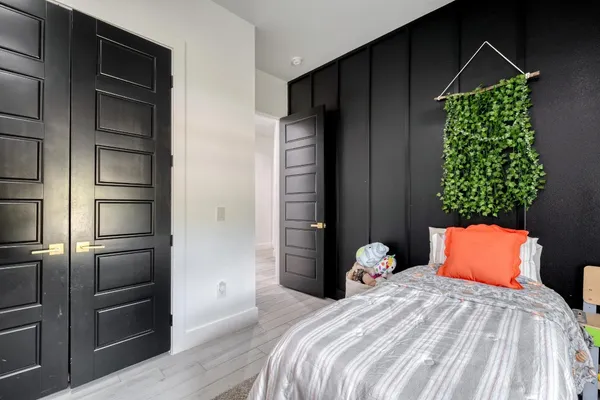 a bedroom with bed and a window