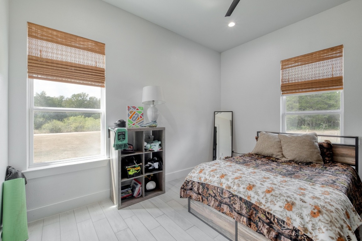 1901 Highway 21, Unit B Paige, TX 78659 - Photo 13 of 40 a bedroom with a large bed and a window