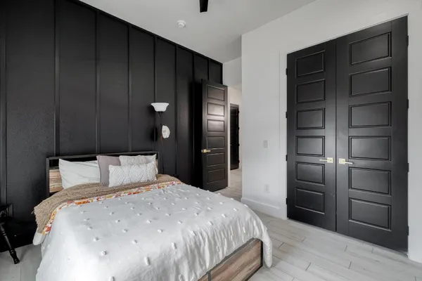 a bedroom with a bed and a closet