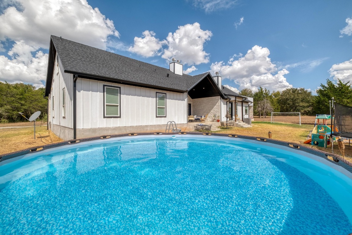 1901 Highway 21, Unit B Paige, TX 78659 - Photo 22 of 40 a view of a house with swimming pool and a yard