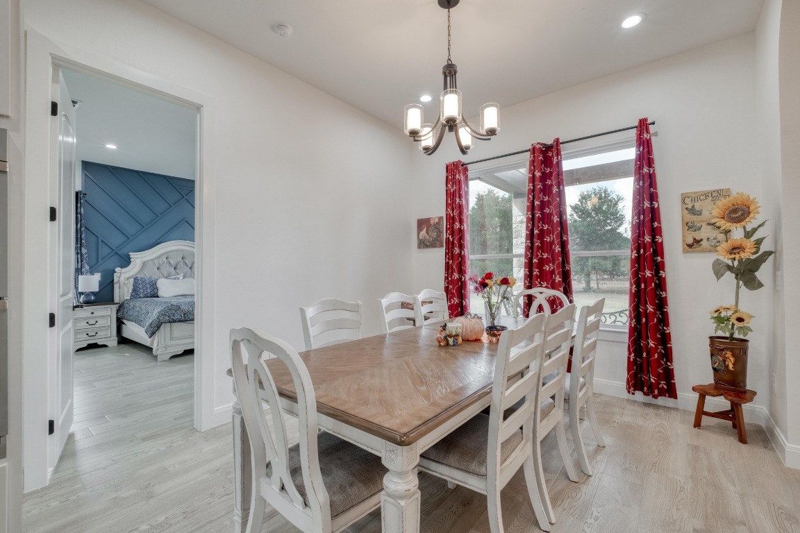 1901 Highway 21, Unit B Paige, TX 78659 - Photo 27 of 40 a view of a dining room with furniture chandelier and a chandelier