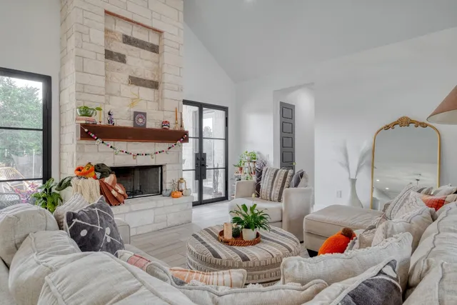 a living room with furniture and a fireplace