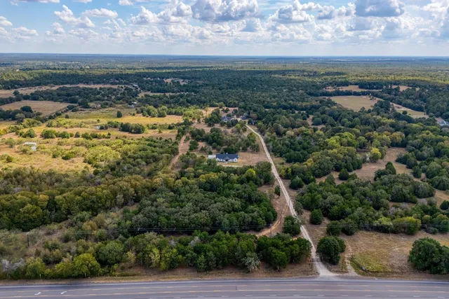 an aerial view of residential building and car parked