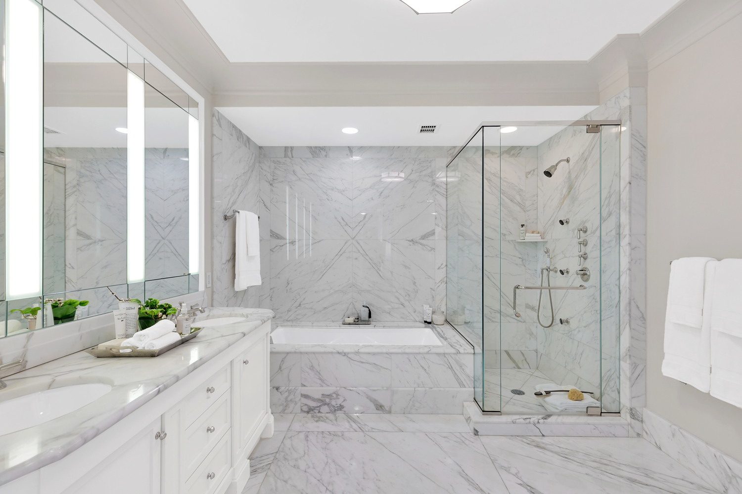 15 Central Park West, Unit 8B Manhattan, NY 10023 - Photo 8 of 13 a bathroom with a granite countertop sink mirror and shower