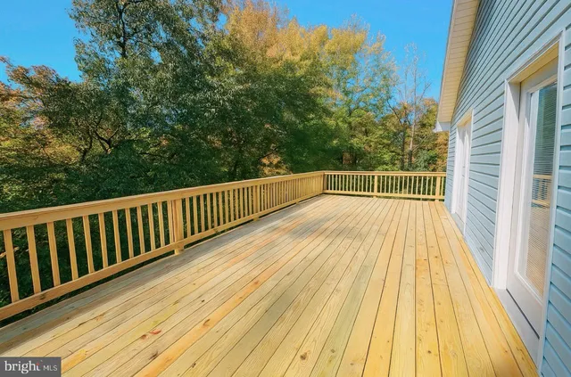 a view of balcony with wooden floor