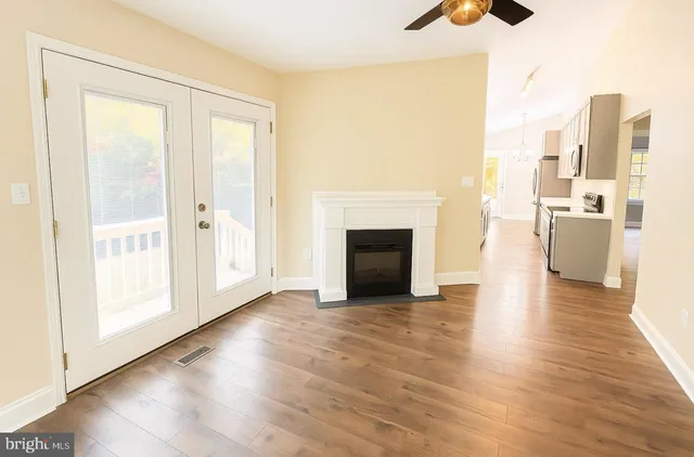 a view of a livingroom with wooden floor